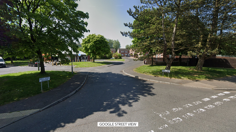 Taxi driver shot by masked men through car window in west Belfast