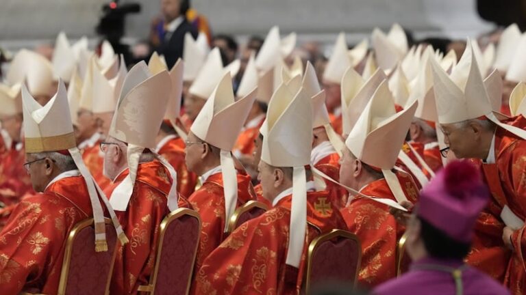 Cardinals electing the next pope begin processing into the Sistine Chapel to open the conclave