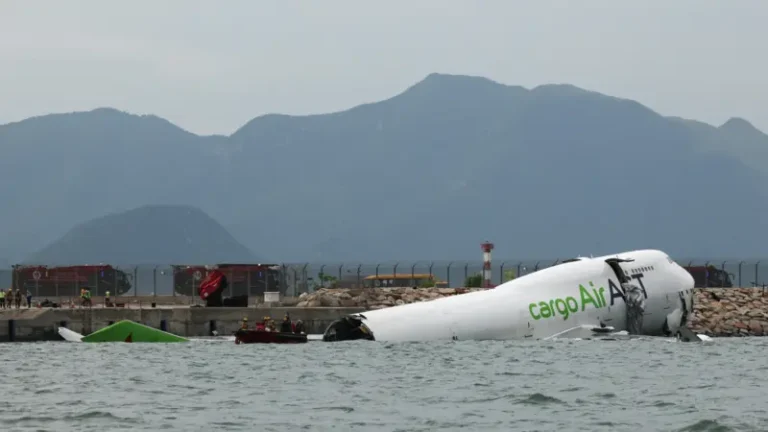 A cargo plane has skidded off a runway at Hong Kong International Airport and landed in the sea, killing two persons, local media have reported
